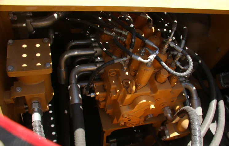 Control valve identification plate mounted on a red valve body