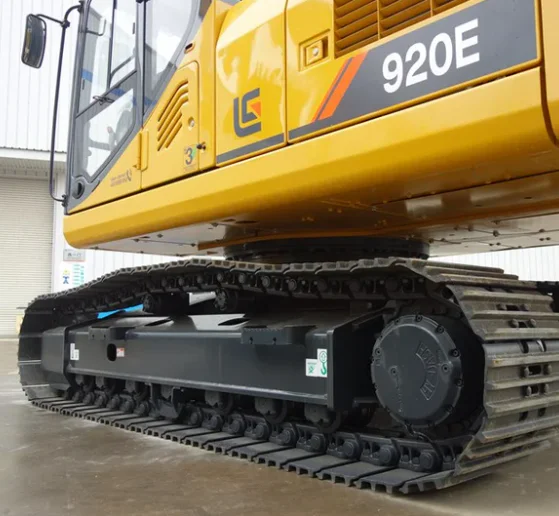 Older excavator and a used travel motor awaiting replacement